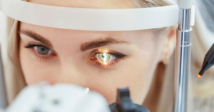 patient during retina image scan at eye doctor